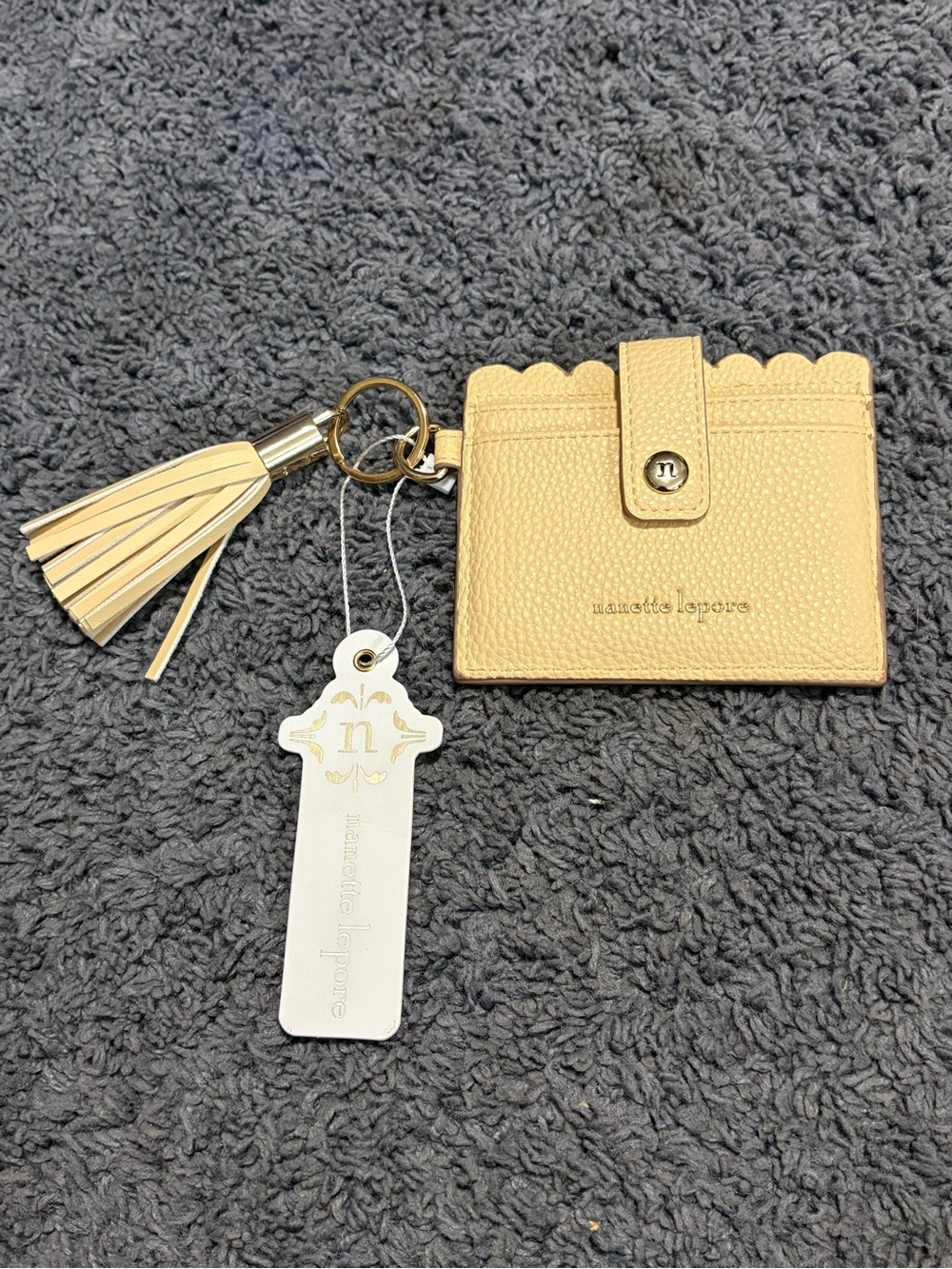 NWT Nanette Lepore cream colored keychain wallet with a tassel